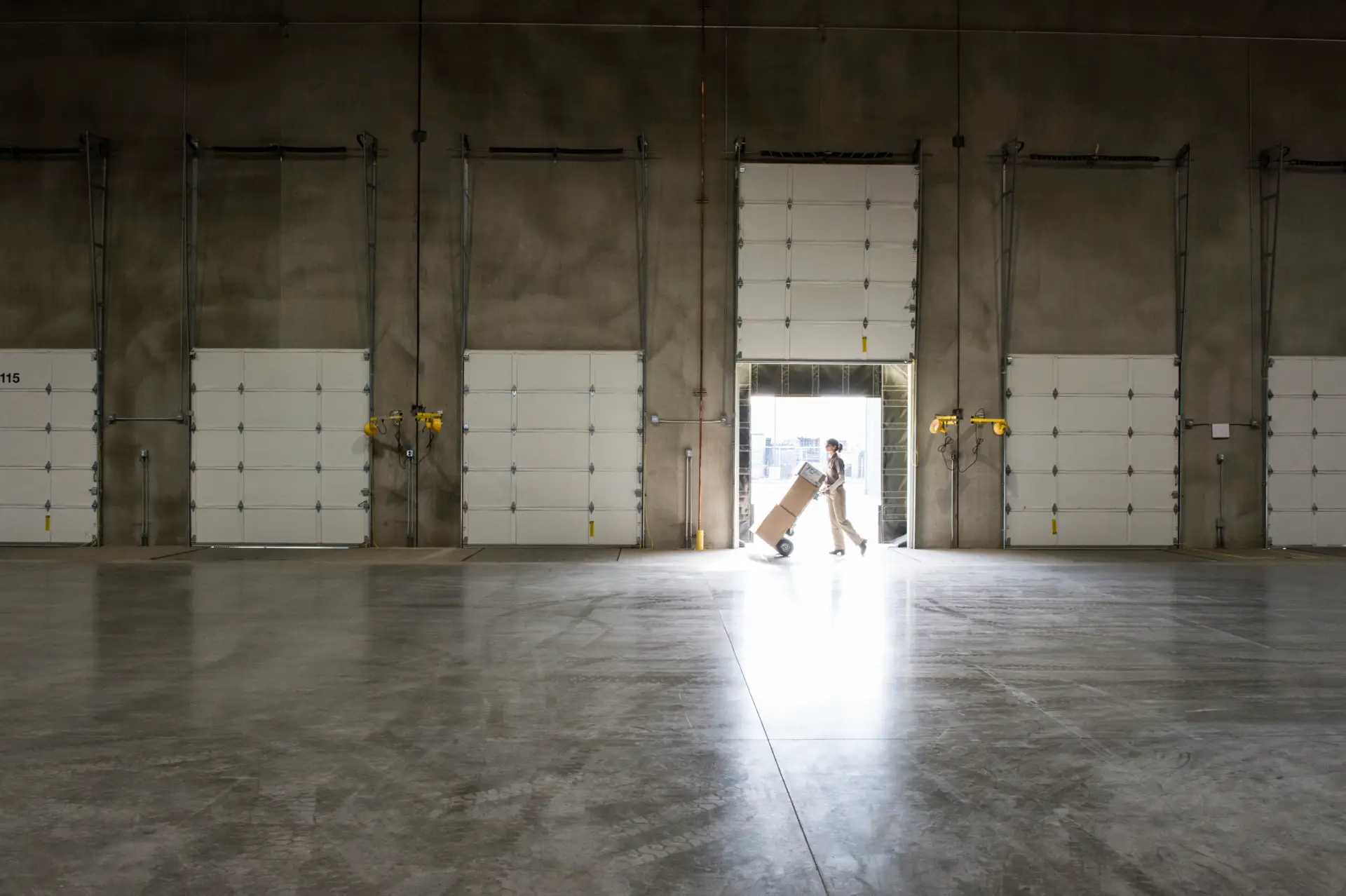 A Warehouse Worker With A Hand Truck At A Loading 2026 03 25 02 59 35 Utc