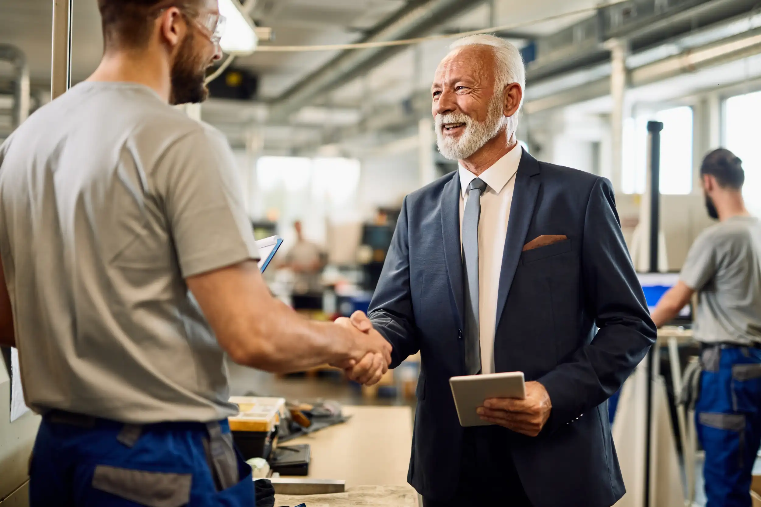 Happy Senior Businessman Handshaking With Manual W 2026 01 06 10 28 20 Utc